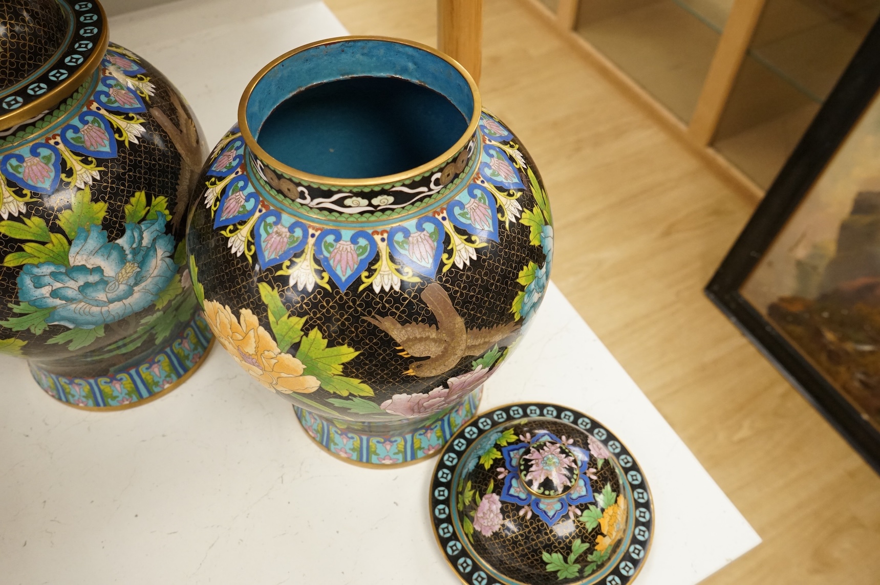 A pair of Chinese cloisonné baluster jars and covers decorated with birds and flowers, 38cm high